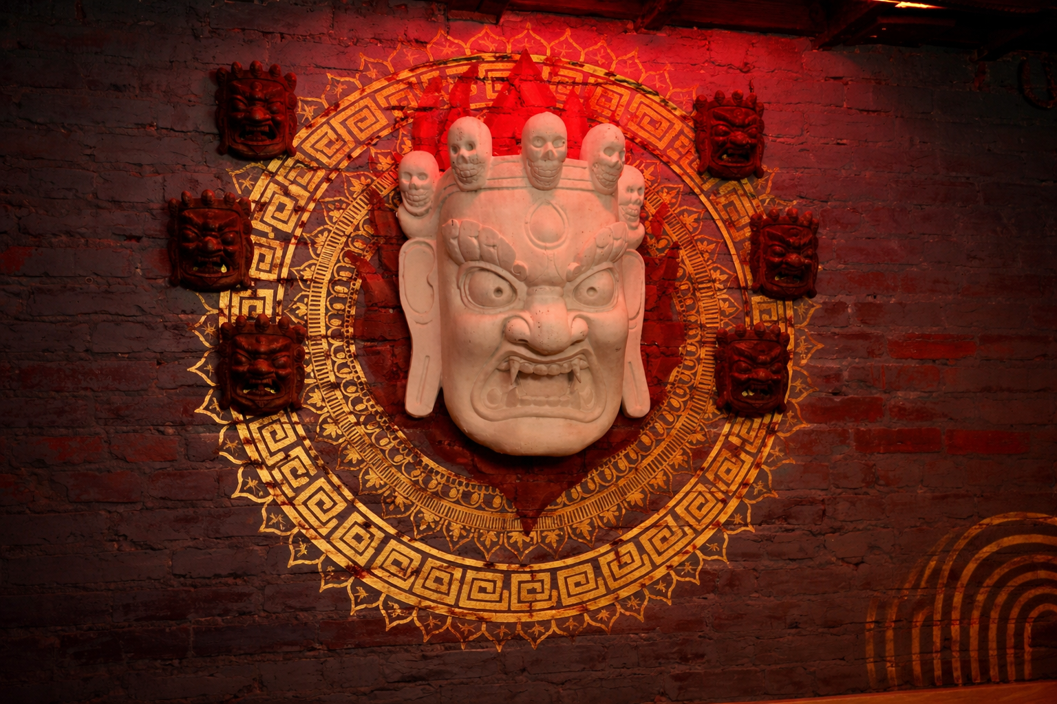 Artfully plated Nepalese tapas dish with colorful vegetables, herbs, and traditional spices arranged on dark slate plate